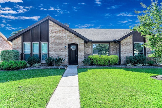 1223 Park Royale Ln, Katy, TX 77450 - mid-century inspired home featuring a front yard, a shingled roof, and brick siding