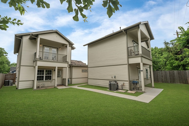 back of property featuring a balcony and central AC unit