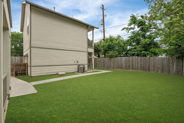 view of yard with central AC