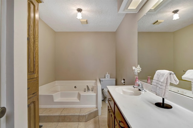 26410 Anderson Rd, Magnolia, TX 77354 - bathroom with toilet, a garden tub, a textured ceiling, vanity, and tile patterned floors