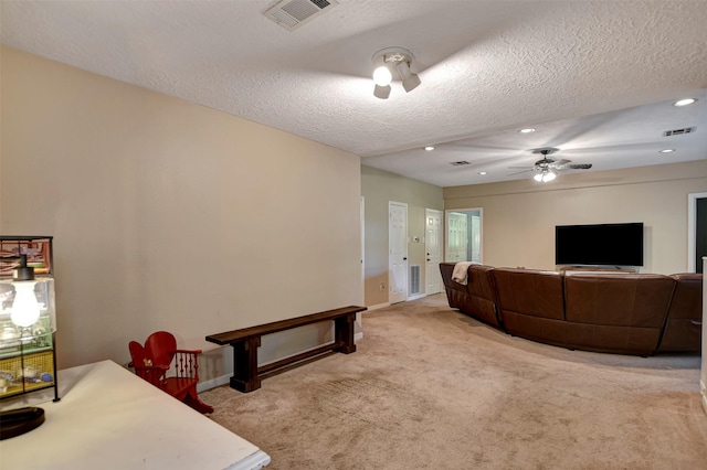 26410 Anderson Rd, Magnolia, TX 77354 - carpeted living room with a ceiling fan, a textured ceiling, baseboards, and recessed lighting