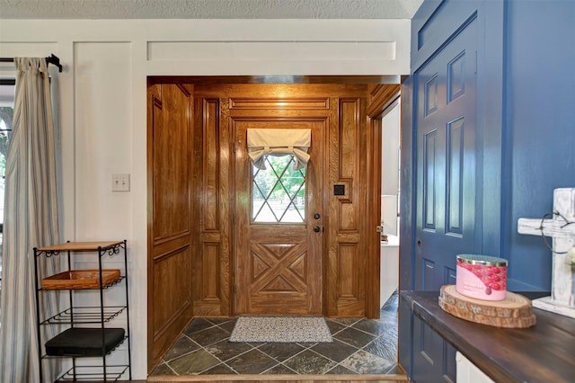 26410 Anderson Rd, Magnolia, TX 77354 - doorway to outside featuring a textured ceiling