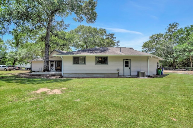 26410 Anderson Rd, Magnolia, TX 77354 - back of property featuring a yard and cooling unit