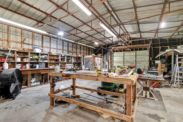 26410 Anderson Rd, Magnolia, TX 77354 - garage with a workshop area and metal wall