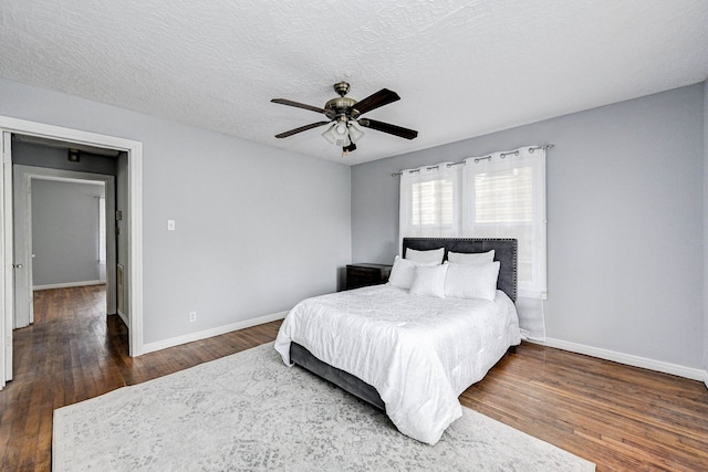 1215 Ashland St, Houston, TX 77008 - bedroom featuring baseboards, wood finished floors, a ceiling fan, and a textured ceiling