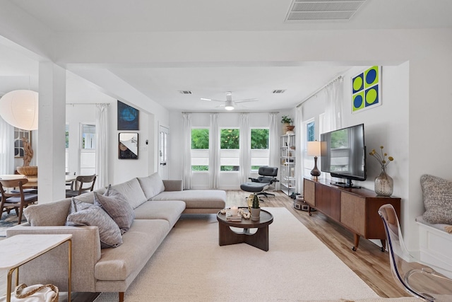 717 E 23rd St, Houston, TX 77008 - living room featuring light wood-type flooring and ceiling fan