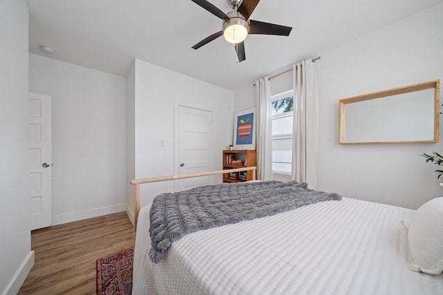 717 E 23rd St, Houston, TX 77008 - bedroom with wood finished floors, baseboards, and a ceiling fan
