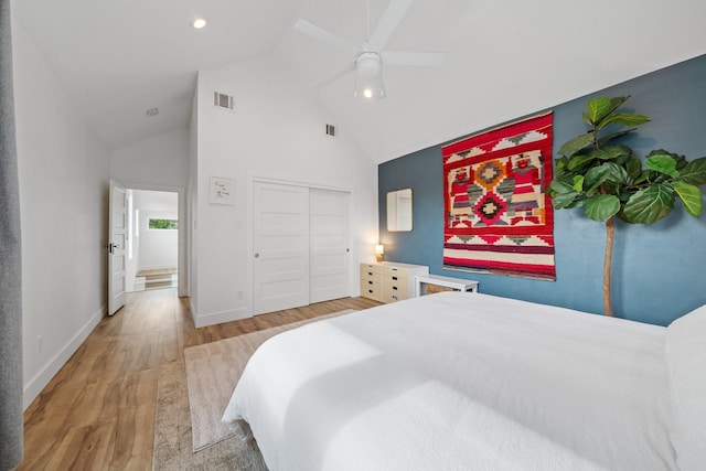 717 E 23rd St, Houston, TX 77008 - bedroom featuring wood finished floors, high vaulted ceiling, a closet, ceiling fan, and baseboards