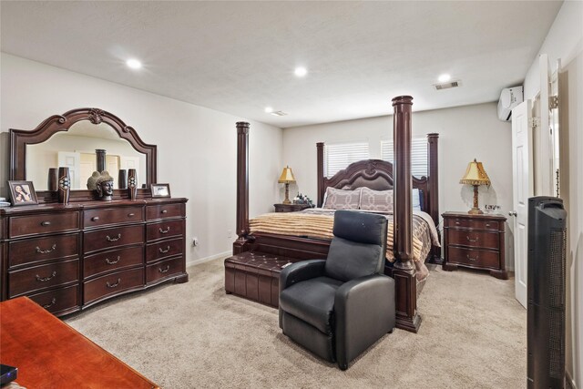 22022 Guston Hall Ln, Katy, TX 77449 - bedroom featuring light carpet, a wall unit AC, recessed lighting, and baseboards