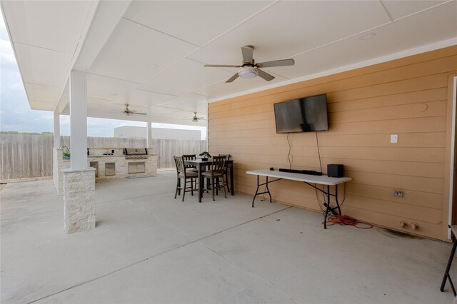 22022 Guston Hall Ln, Katy, TX 77449 - view of patio featuring an outdoor kitchen, fence, ceiling fan, and an outdoor bar