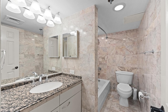 full bath featuring tile walls, toilet, shower / bathtub combination, and vanity