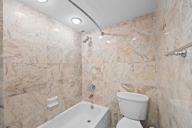 bathroom with  shower combination, toilet, and tile walls