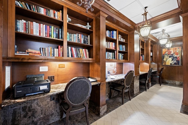 office featuring built in study area, crown molding, tile patterned floors, a chandelier, and wood walls
