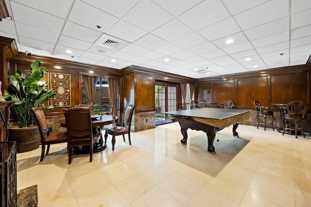 game room featuring crown molding, wood walls, a paneled ceiling, and pool table