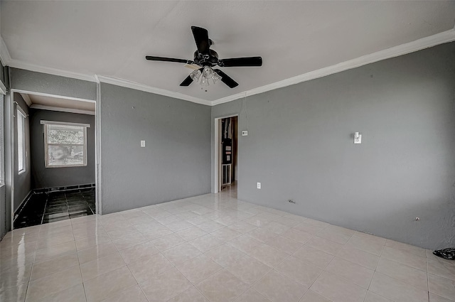 tiled empty room featuring crown molding and a ceiling fan