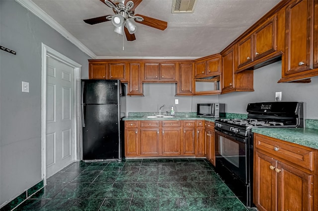 kitchen with black appliances, brown cabinetry, a ceiling fan, a sink, and ornamental molding