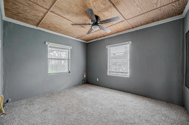 carpeted empty room with healthy amount of natural light and a ceiling fan