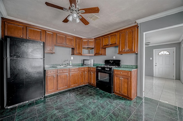 kitchen with black appliances, a ceiling fan, brown cabinets, crown molding, and a sink