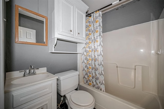 bathroom featuring toilet, vanity, and shower / tub combo with curtain