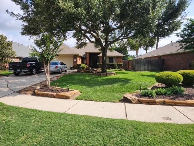 view of front of property with driveway and a garage