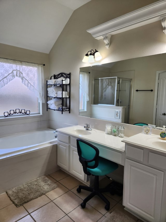 full bath with vaulted ceiling, tile patterned floors, a shower stall, a garden tub, and vanity