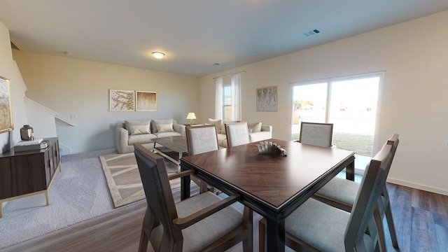 21631 Cottage Ln, New Caney, TX 77357 - dining room with dark wood-style floors and baseboards