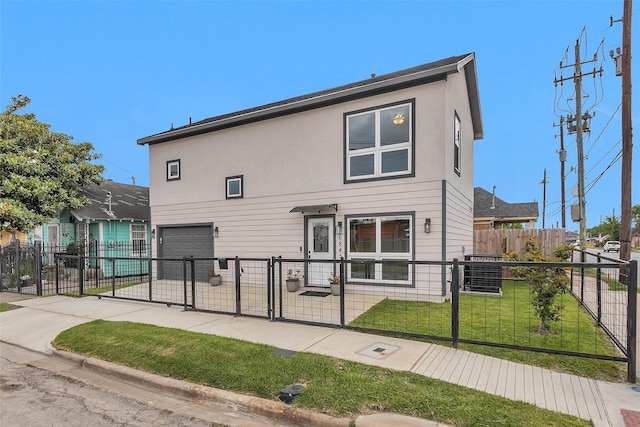 back of house featuring an attached garage, a gate, cooling unit, concrete driveway, and stucco siding