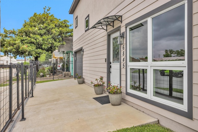 view of patio featuring fence