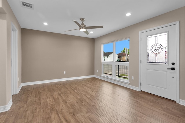 foyer featuring ceiling fan, light wood-style flooring, baseboards, and recessed lighting