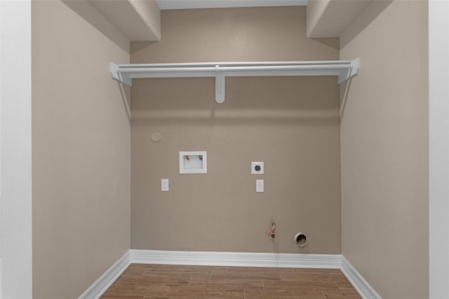 laundry room with hookup for a gas dryer, washer hookup, hookup for an electric dryer, and wood tiled floors