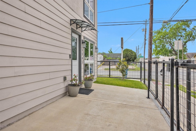 view of patio / terrace featuring fence