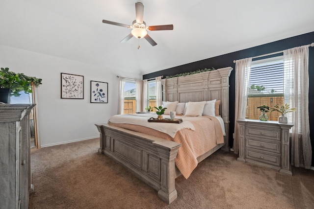 bedroom with carpet floors, lofted ceiling, ceiling fan, and baseboards
