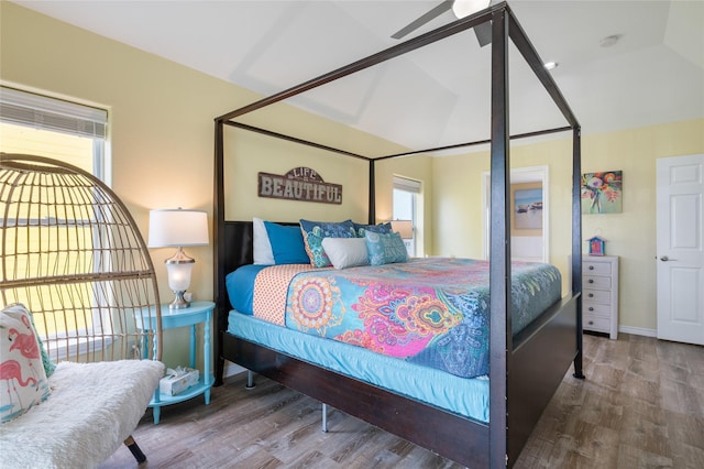 bedroom with wood finished floors and baseboards