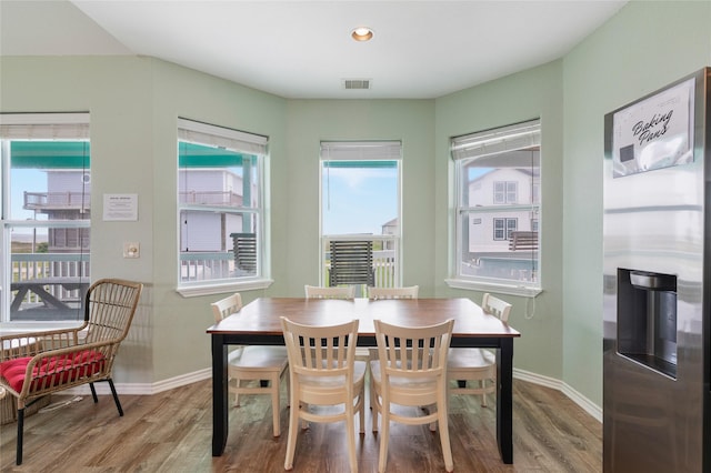 dining room with wood finished floors and baseboards