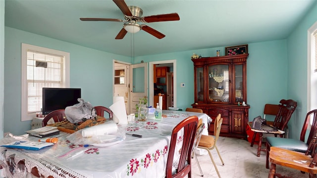 415 Briarcliff Dr, Houston, TX 77076 - dining space with ceiling fan, healthy amount of natural light, and light marble finish flooring