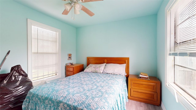 415 Briarcliff Dr, Houston, TX 77076 - bedroom with multiple windows, wood finished floors, and ceiling fan