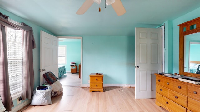 415 Briarcliff Dr, Houston, TX 77076 - bedroom with light wood-style floors, baseboards, and a ceiling fan