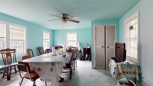 415 Briarcliff Dr, Houston, TX 77076 - dining space with a ceiling fan and light marble finish floors