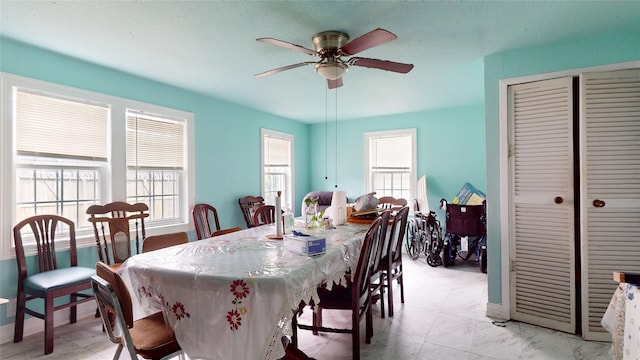 415 Briarcliff Dr, Houston, TX 77076 - dining area with a ceiling fan and baseboards