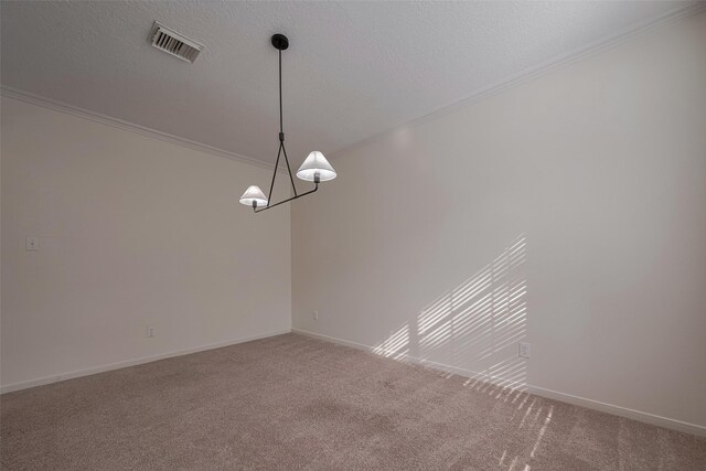 carpeted spare room with ornamental molding and baseboards