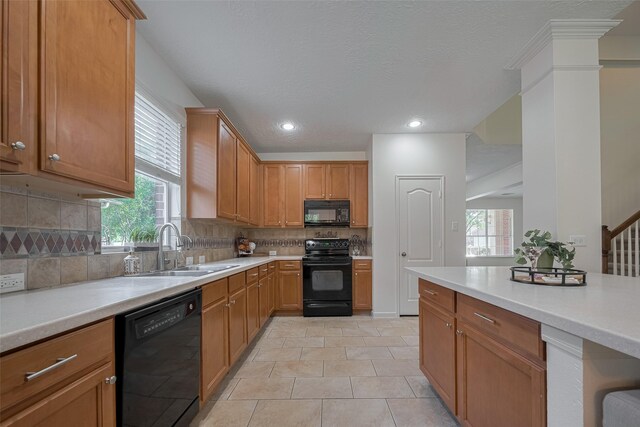 31214 Windcrest Park Ln, Spring, TX 77386 - kitchen with black appliances, healthy amount of natural light, light countertops, backsplash, and recessed lighting