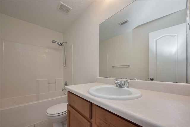 bathroom featuring toilet, vanity, bathing tub / shower combination, and tile patterned flooring