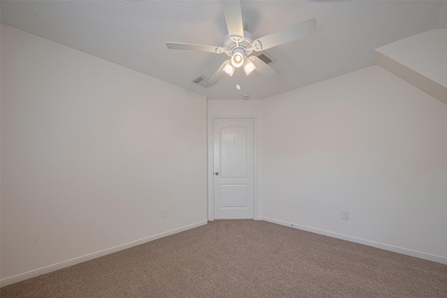 empty room with a ceiling fan, light colored carpet, and baseboards
