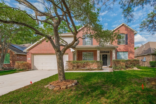 traditional-style home with brick siding, an attached garage, a front lawn, and concrete driveway