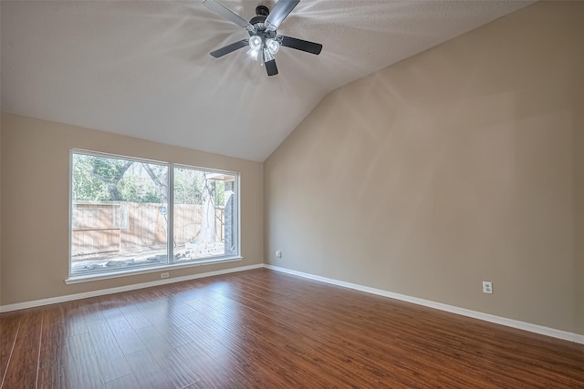 194 Velvet Leaf Pl, The Woodlands, TX 77380 - empty room featuring vaulted ceiling, dark wood finished floors, baseboards, and ceiling fan