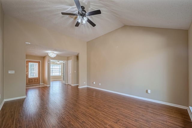 194 Velvet Leaf Pl, The Woodlands, TX 77380 - unfurnished living room featuring a textured ceiling, ceiling fan, wood finished floors, vaulted ceiling, and baseboards