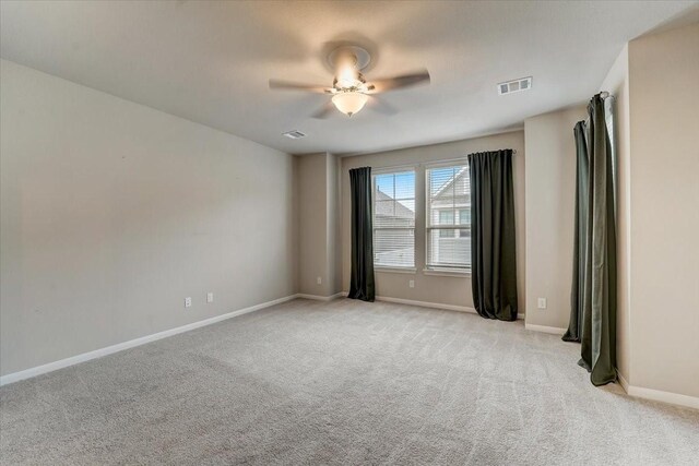 9438 Caddo Ridge Ln, Cypress, TX 77433 - spare room featuring light colored carpet, baseboards, and ceiling fan