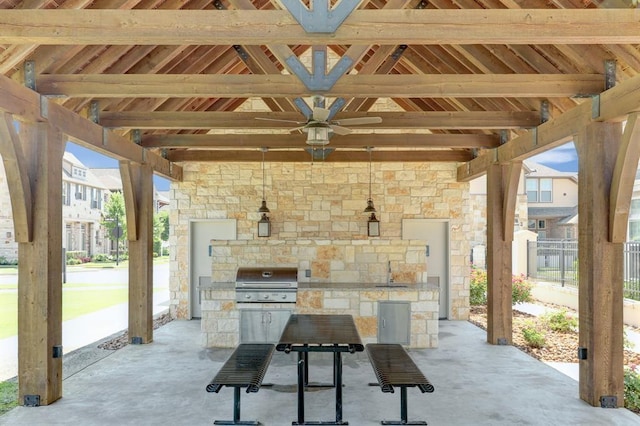 9438 Caddo Ridge Ln, Cypress, TX 77433 - view of patio / terrace featuring a gazebo, exterior kitchen, a sink, ceiling fan, and exterior fireplace