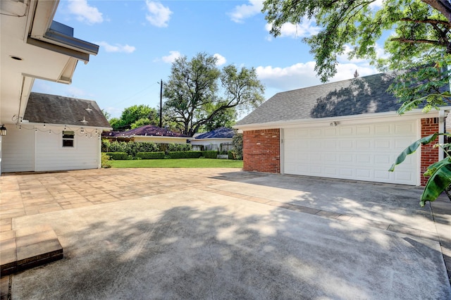 garage featuring driveway