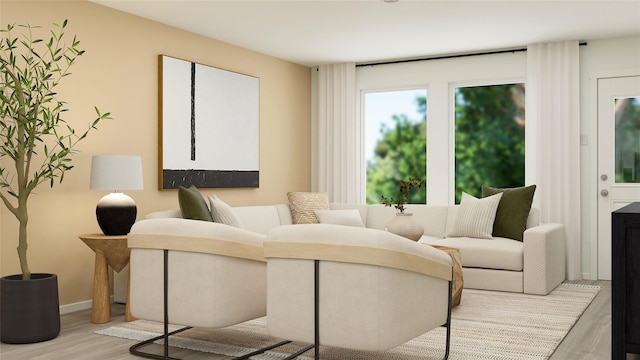 living area with wood finished floors and baseboards